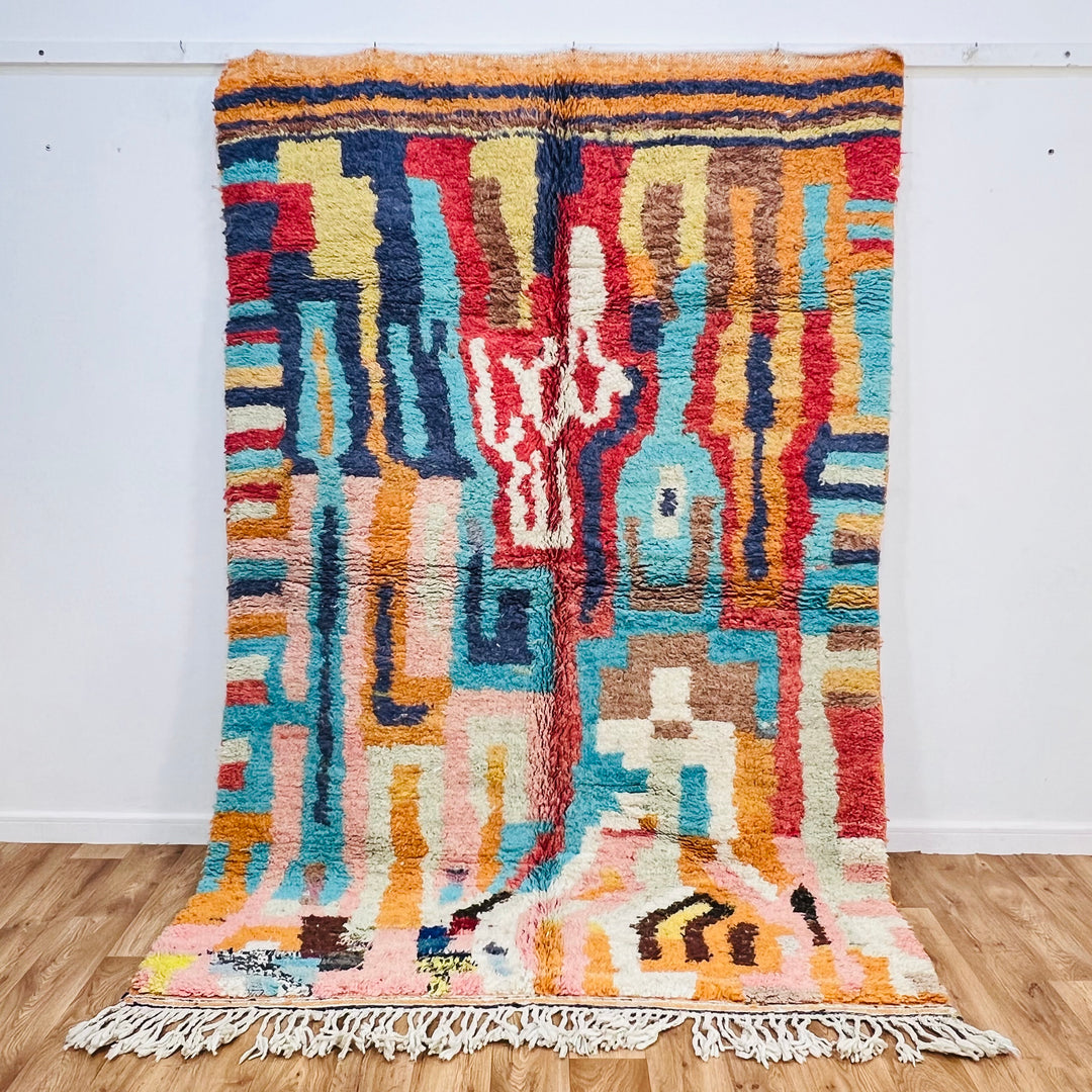 Bold Geometric Moroccan Wool Rug in vibrant colors, 250x163 cm, featuring maze-like patterns in orange, blue, and red.