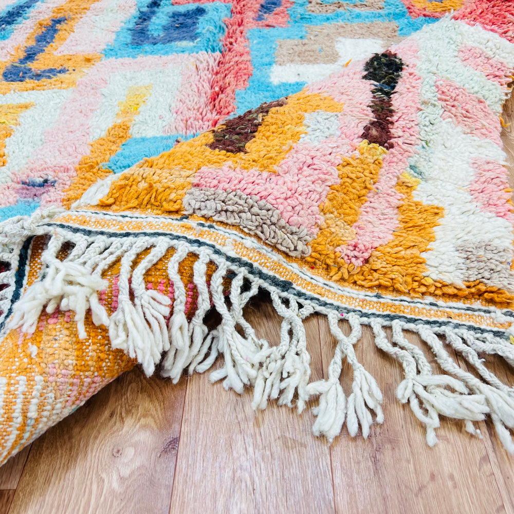 Bold Geometric Moroccan Wool Rug, vibrant orange, blue, red, pink pattern featuring fringe. Handmade traditional craftsmanship, 250x163 cm.