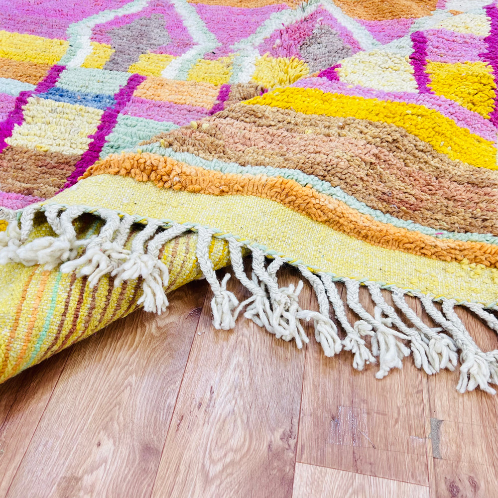 Colorful Moroccan wool rug with yellow, pink, orange diamonds, handmade Berber style, 260 x 158 cm, vibrant and plush.