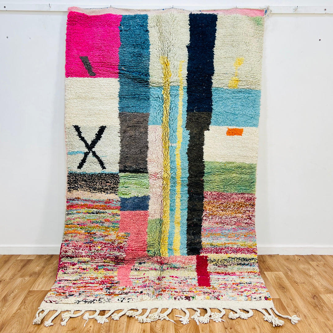 Colorful Moroccan Berber Wool Rug with abstract patterns, handmade from natural wool. Perfect Moroccan area carpet for vibrant decor.