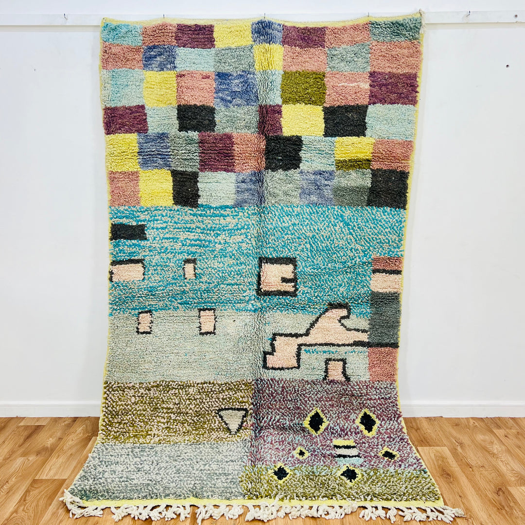 Colorful vintage Moroccan rug with checkerboard and geometric patterns, handmade using traditional Berber techniques.