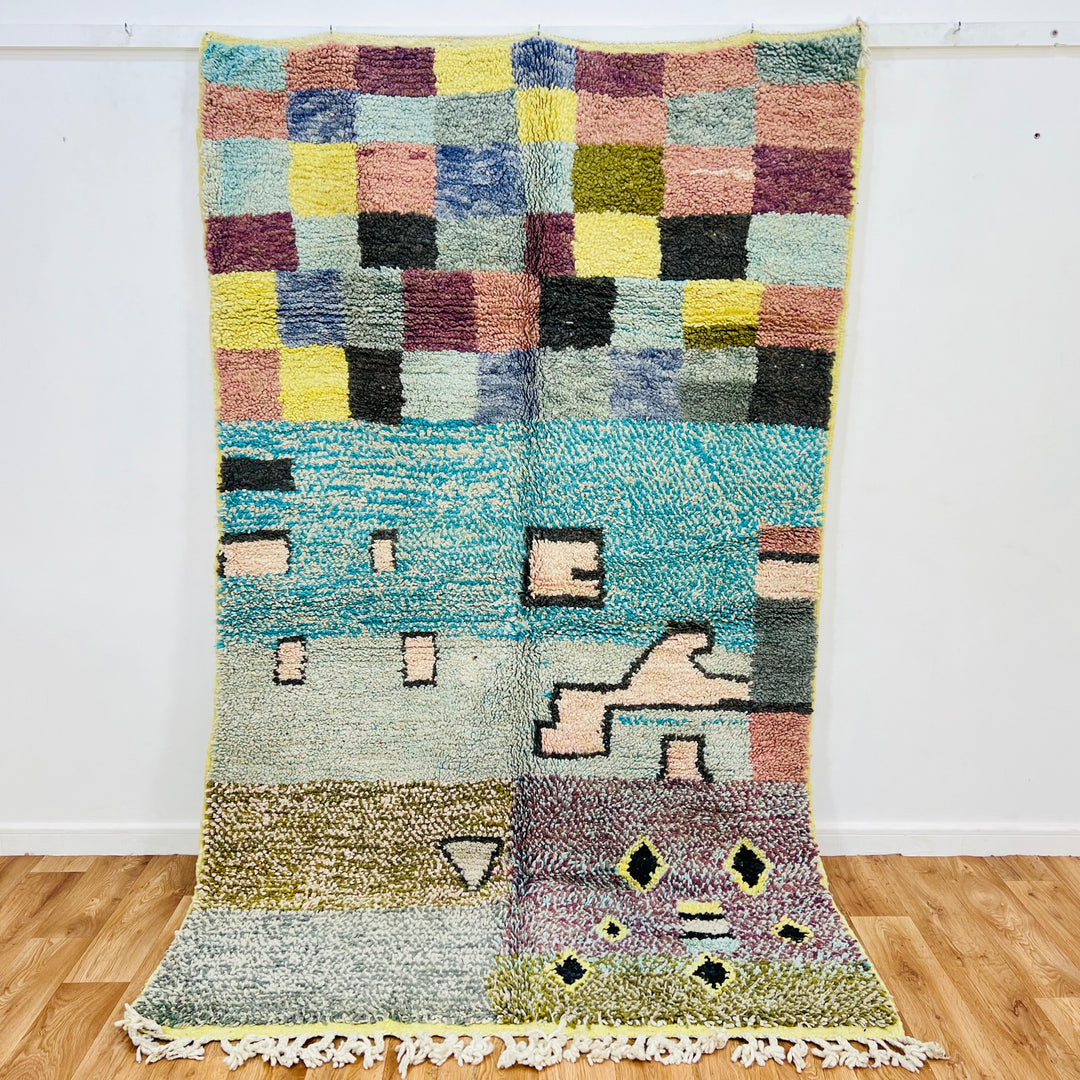Vintage Moroccan rug with colorful checkerboard and geometric patterns, handmade with traditional Berber techniques.