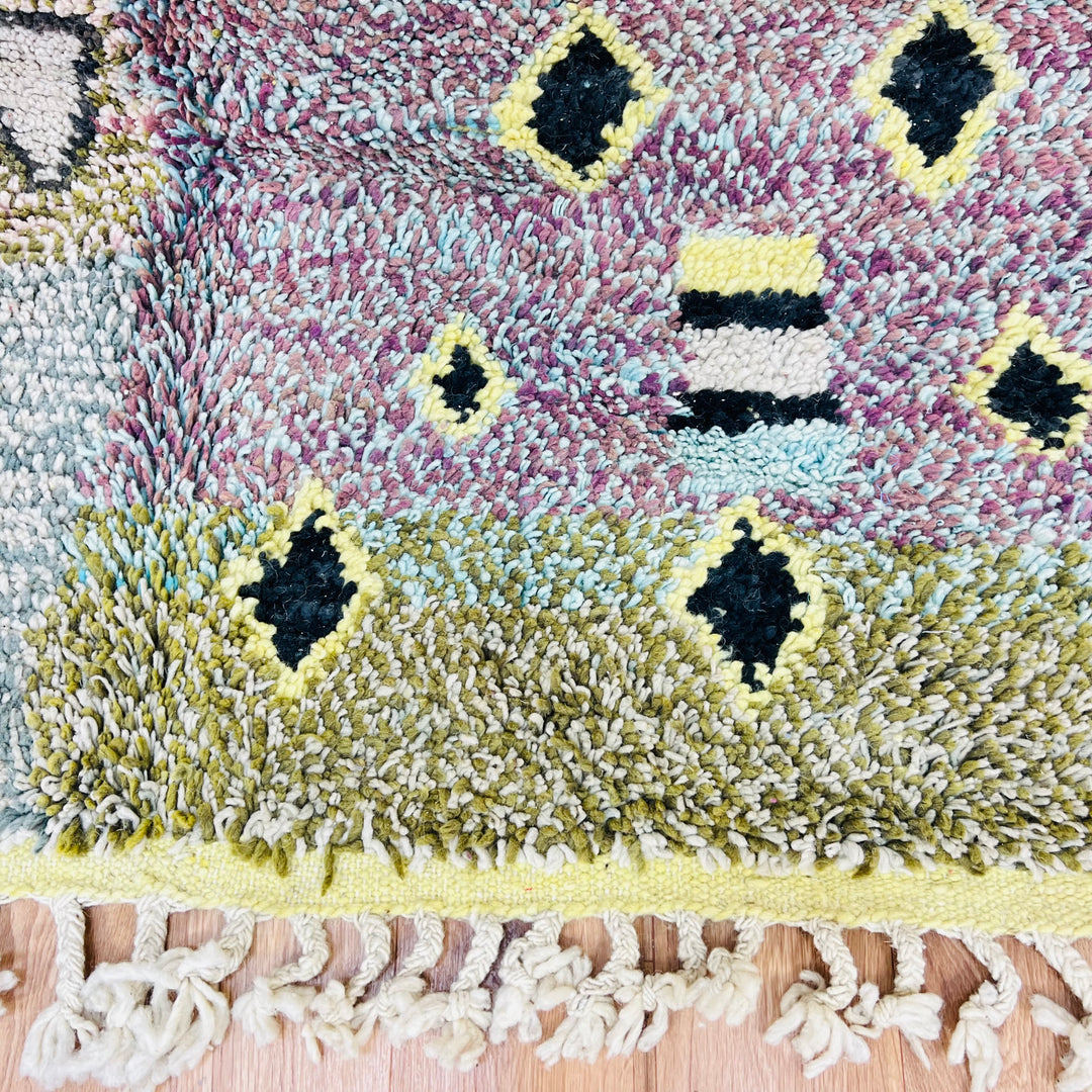 Colorful vintage Moroccan Berber rug with geometric patterns, handmade using traditional weaving, ideal for Moroccan interior décor.