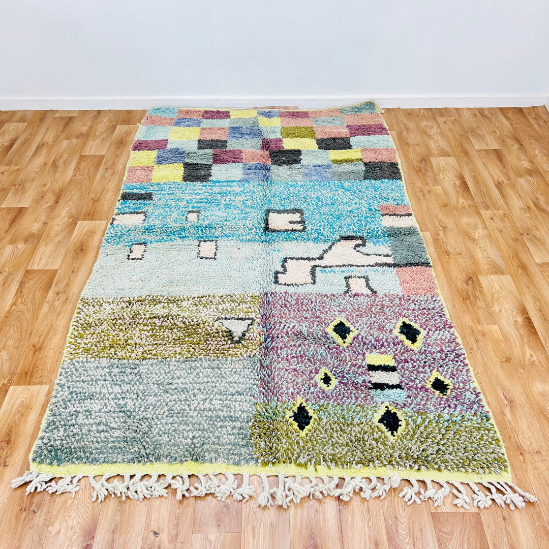 Vintage Moroccan rug with colorful checkerboard and abstract designs, handwoven using traditional Berber techniques, 8.3 x 4.9 ft.