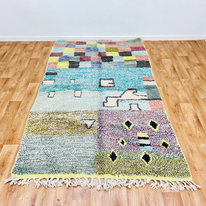 Vintage Moroccan rug with colorful checkerboard and abstract designs, handwoven using traditional Berber techniques, 8.3 x 4.9 ft.