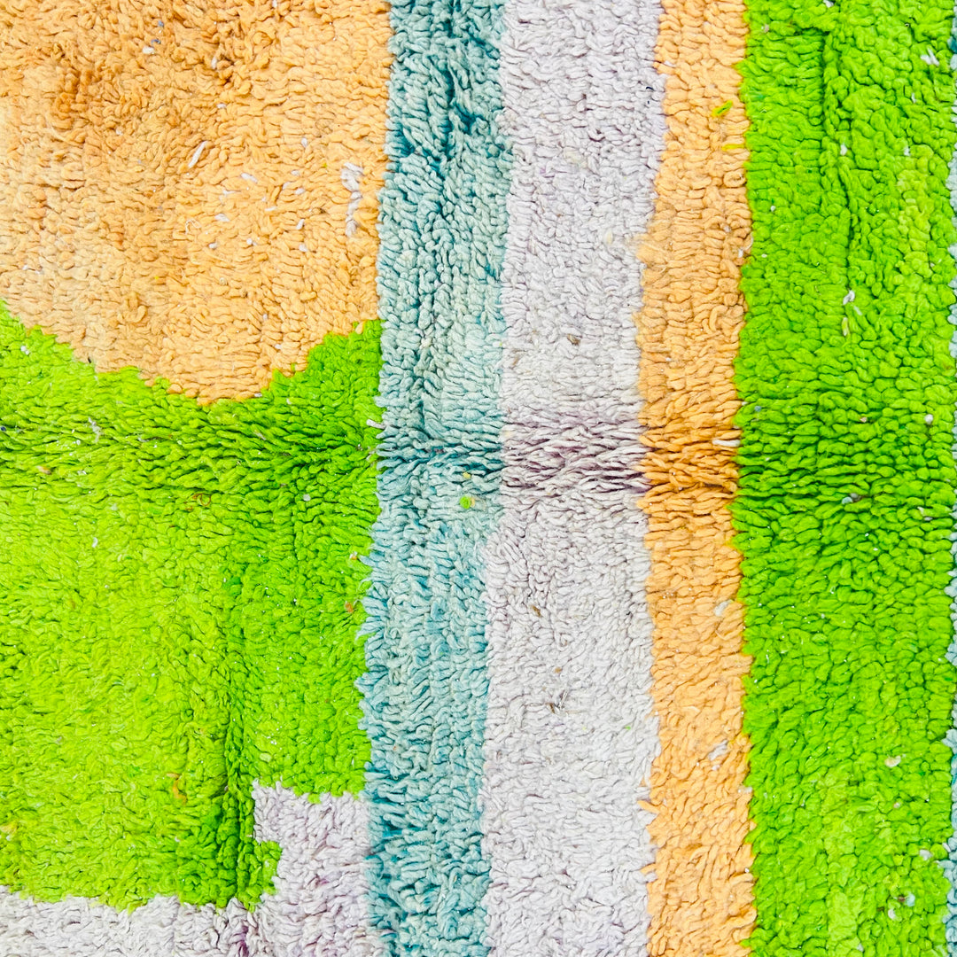 Handmade Moroccan wool rug with bold lime green, orange, and ivory abstract geometric design. Traditional Berber carpet. 260 x 163 cm.