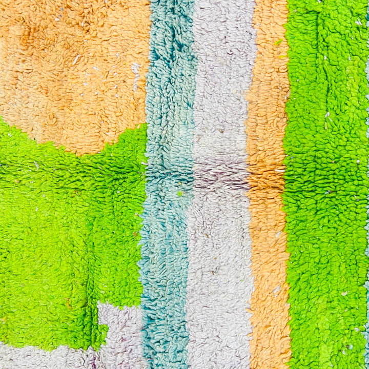 Handmade Moroccan wool rug with bold lime green, orange, and ivory abstract geometric design. Traditional Berber carpet. 260 x 163 cm.