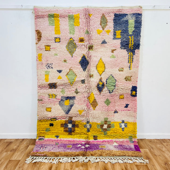 Pink and yellow vintage Moroccan rug with Berber symbols, handmade with 100% wool, bursting with character and tradition.