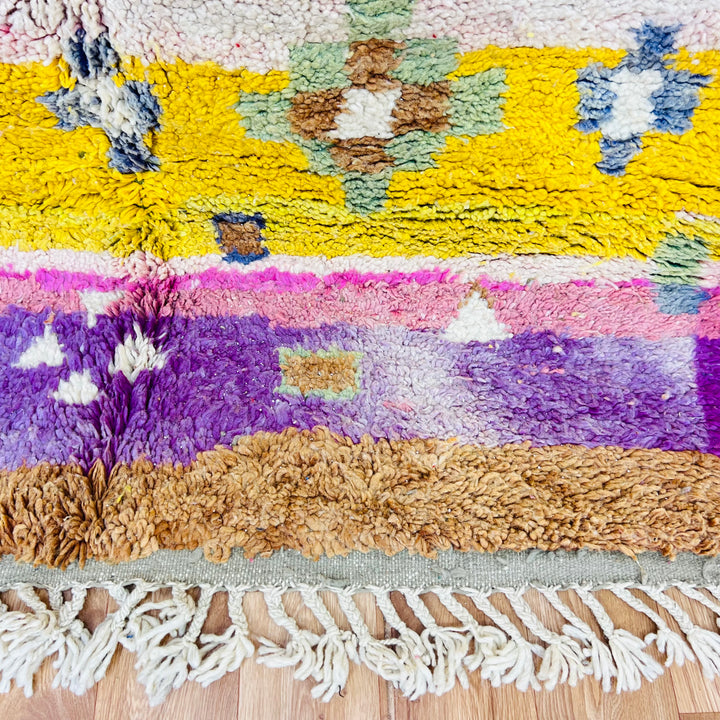 Pink and yellow vintage Moroccan berber rug with diamond motifs, handwoven wool, 237x152 cm, blends traditional and tribal designs.