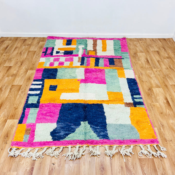Colorful abstract vintage Moroccan rug with geometric design in pink, orange, blue, and earthy tones, 251x154cm, handwoven.