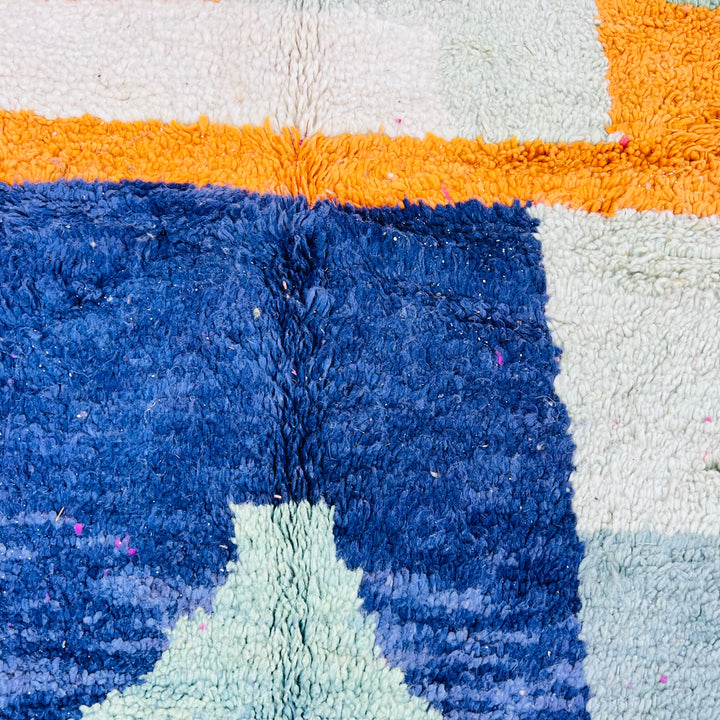 Colorful vintage Moroccan shag rug with geometric design in blue, orange, and mint. Perfect for bohemian and artistic interiors.