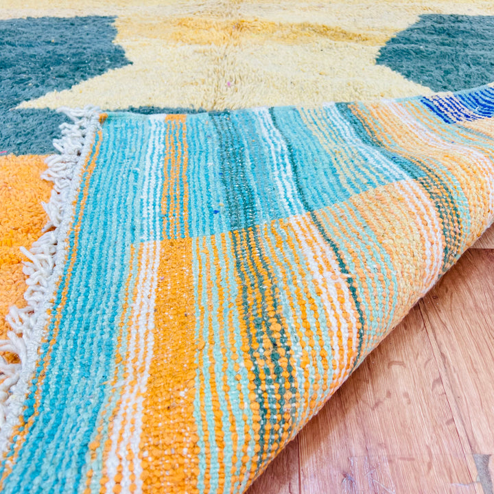 Yellow and green abstract Moroccan Berber rug, 269 x 153 cm, vibrant geometric pattern with golden, aqua, navy, and orange colors.