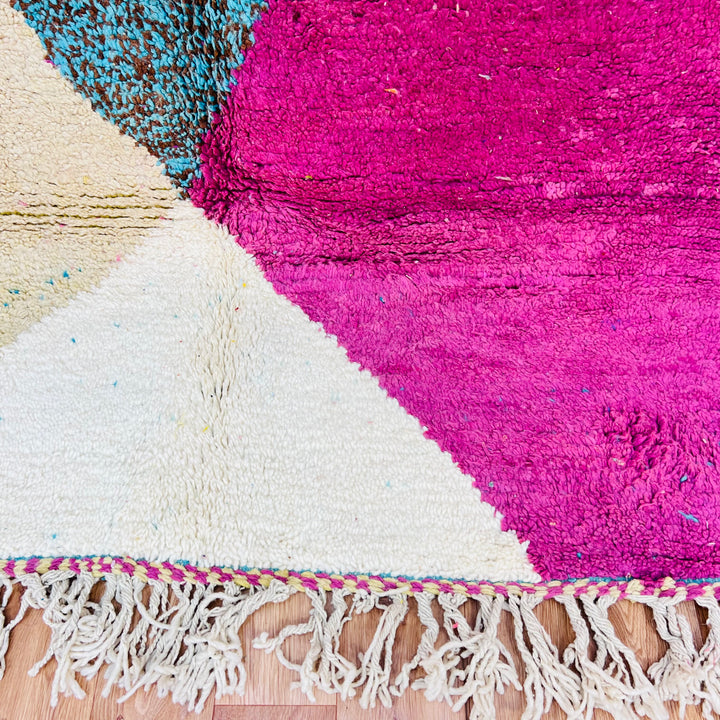 Pink and aqua abstract Moroccan wool rug with geometric pattern, featuring pink, turquoise, cream tones. Handmade traditional Berber design.