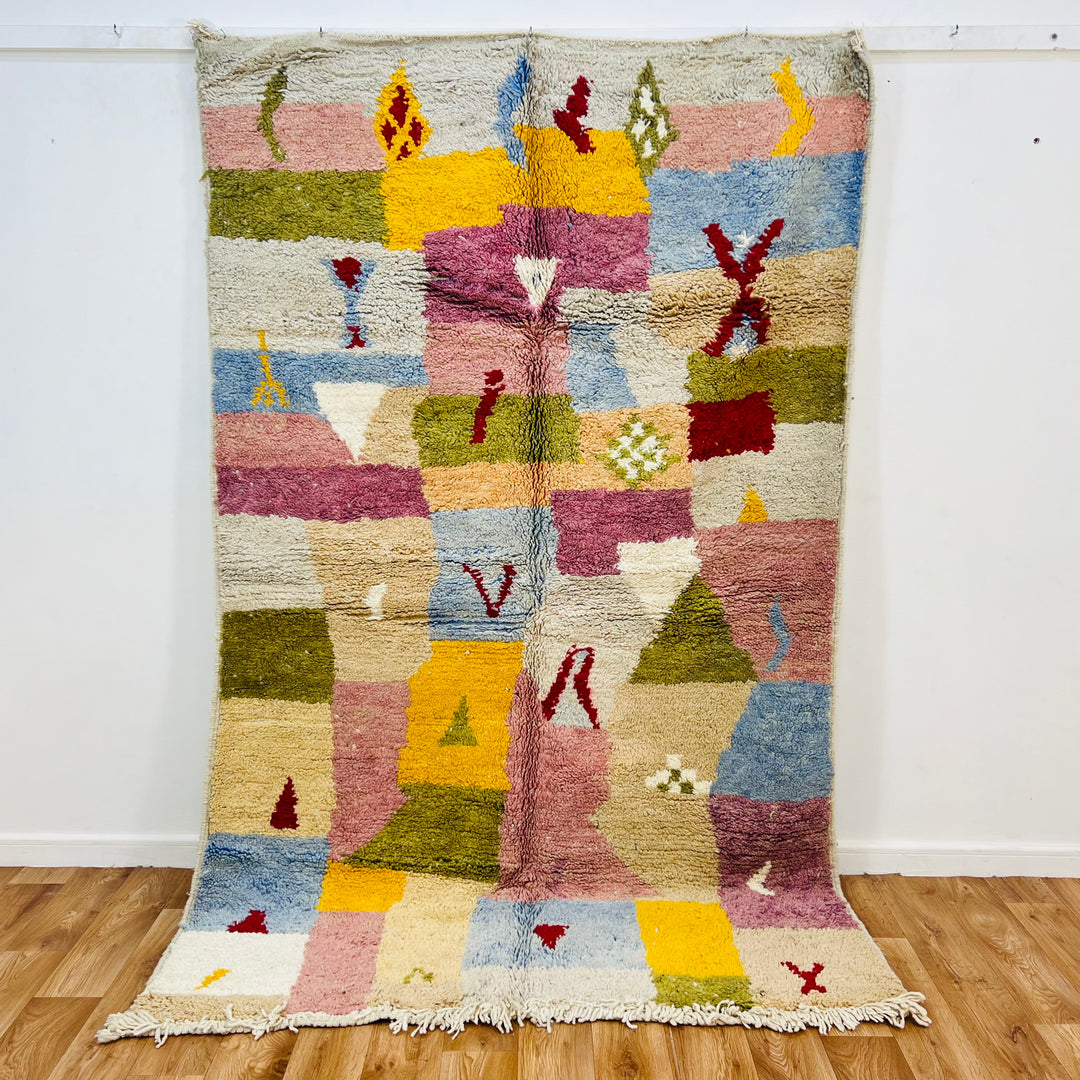 Vintage Moroccan wool rug with colorful Berber patterns, handwoven in Atlas Mountains, 248x153 cm, pink, blue, and olive hues.