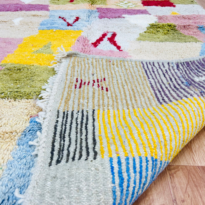 Vintage Moroccan wool rug with colorful patchwork of pink, yellow, blue, and green, handwoven Berber design, size 248x153 cm.