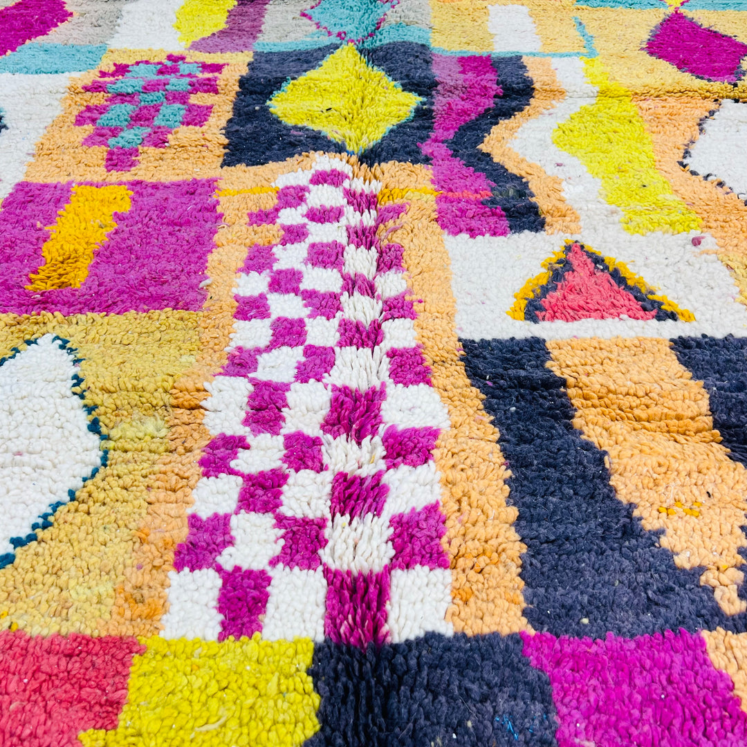 Colorful Beni Mrirt Moroccan rug with pink, yellow, black, and teal diamond and checkerboard motifs, 251 x 164 cm.