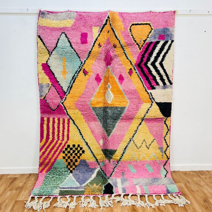 Pink Diamond Moroccan Wool Rug with colorful geometric patterns, handmade by Berber women, showcasing traditional Moroccan design.