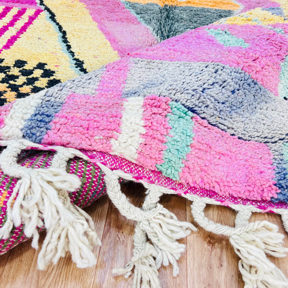 Pink Diamond Moroccan Wool Rug with vivid colors and traditional patterns, handmade by Berber women, showcasing intricate design.