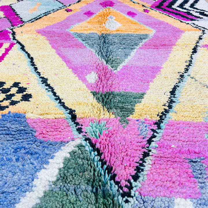 Pink Diamond Moroccan Wool Rug with vibrant geometric designs and colors including pink, mustard, and green. 234x164 cm.