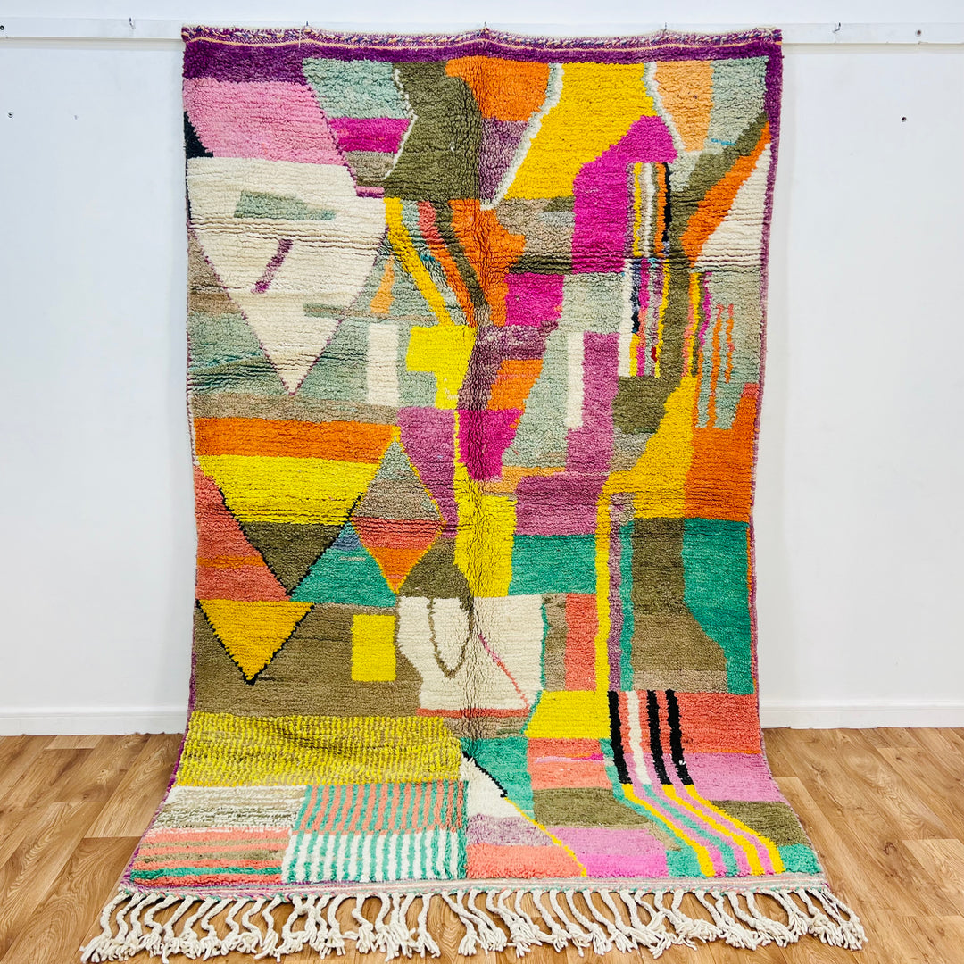 Patchwork Abstract Moroccan Wool Rug with colorful geometric patterns, 259x150 cm, handmade by Berber women, vibrant decor piece.