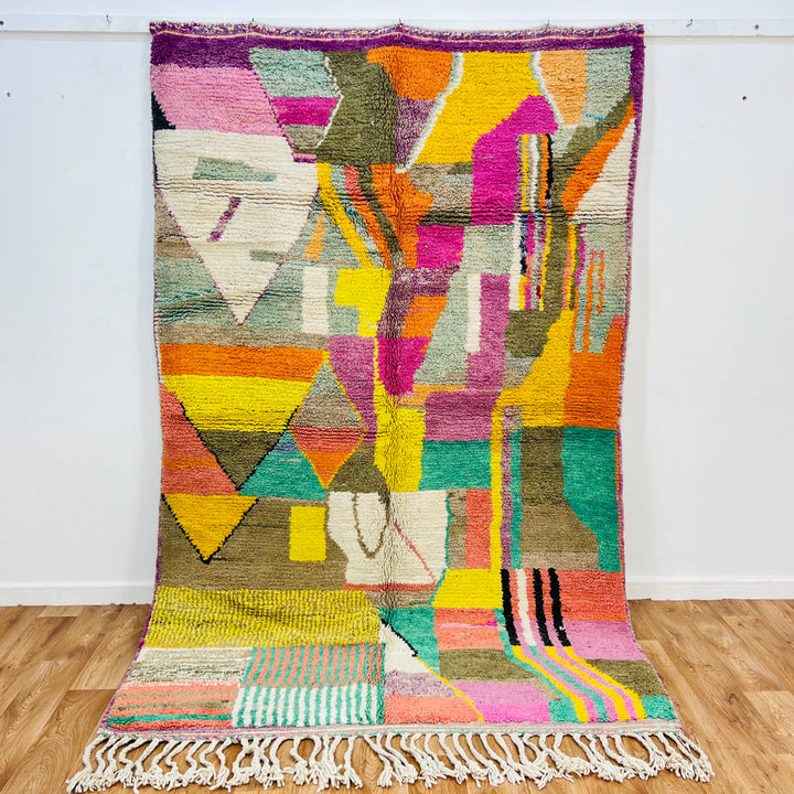 Patchwork Abstract Moroccan Wool Rug with colorful geometric patterns, 259x150 cm, handmade by Berber women, vibrant decor piece.