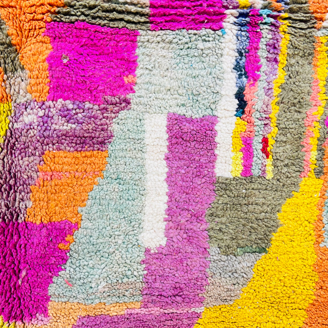 Colorful Patchwork Abstract Moroccan Wool Rug in pink, yellow, and turquoise – vibrant geometric patterns, handwoven by Berber artisans.