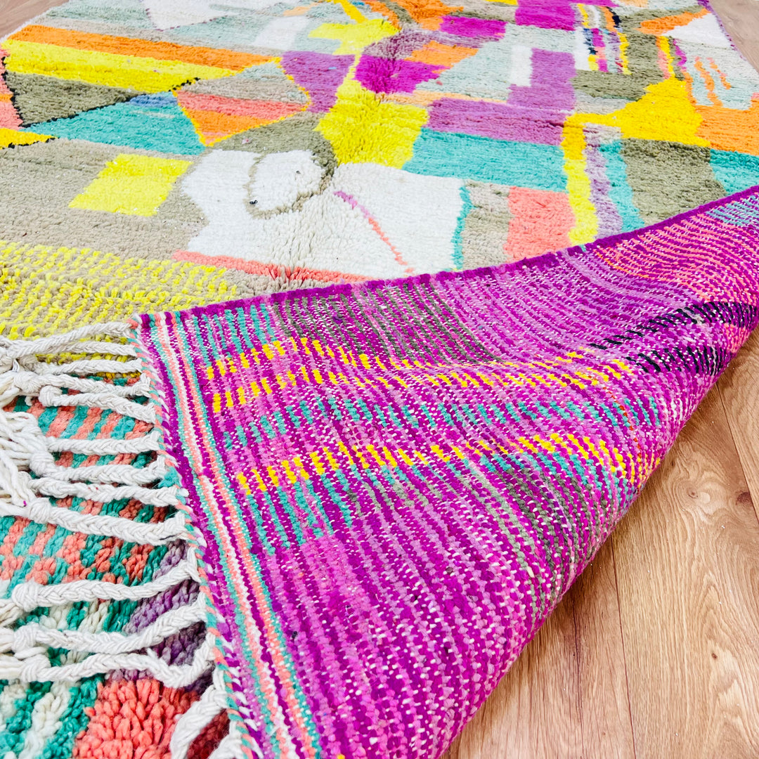 Colorful Patchwork Abstract Moroccan Wool Rug with geometric design and vibrant hues; traditional Berber craftsmanship.