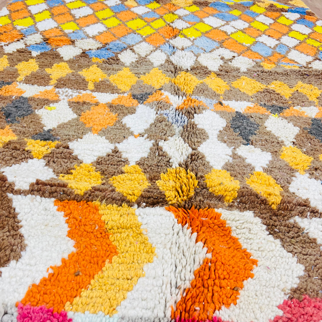 Diamond &amp; Zigzag Moroccan Wool Rug 268x161 cm with vibrant patterns in yellow, brown, sky blue, and sunset tones.