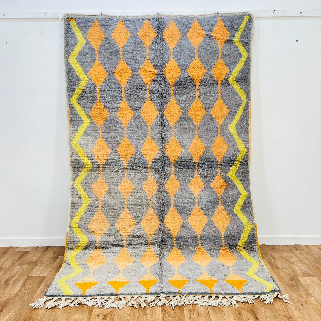 Vintage Moroccan rug with orange and yellow diamond pattern on grey background, handwoven, 255 x 158 cm, wool, Berber style rug