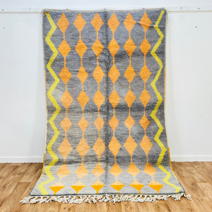 Vintage Moroccan rug with orange and yellow diamond pattern on grey background, handwoven, 255 x 158 cm, wool, Berber style rug