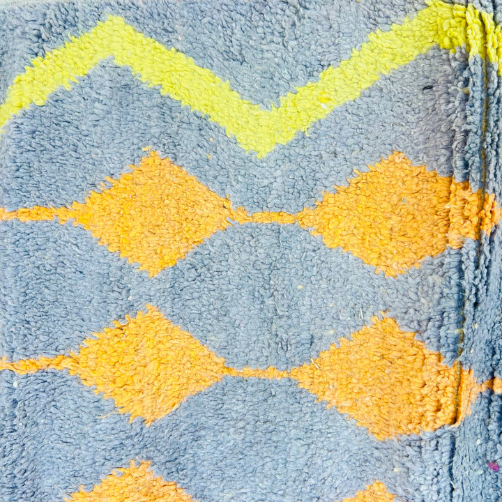 Vintage Moroccan wool rug with orange and yellow diamond motifs on a grey background, 255 x 158 cm, handwoven Berber design.