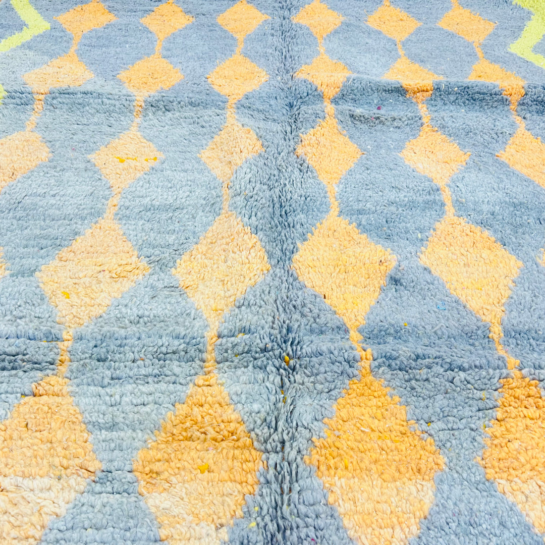 Vintage Moroccan rug with orange and yellow diamond patterns on grey base. Handwoven wool Berber carpet, 255 x 158 cm.