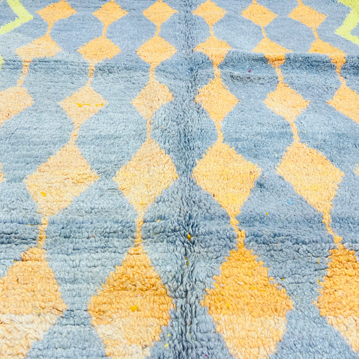 Vintage Moroccan rug with orange and yellow diamond patterns on grey base. Handwoven wool Berber carpet, 255 x 158 cm.