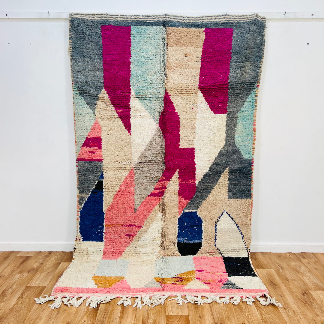 Vintage Abstract Moroccan Rug in pink, beige, navy, grey, mustard. Handwoven wool rug, 254x150 cm, showcases Moroccan Berber art.