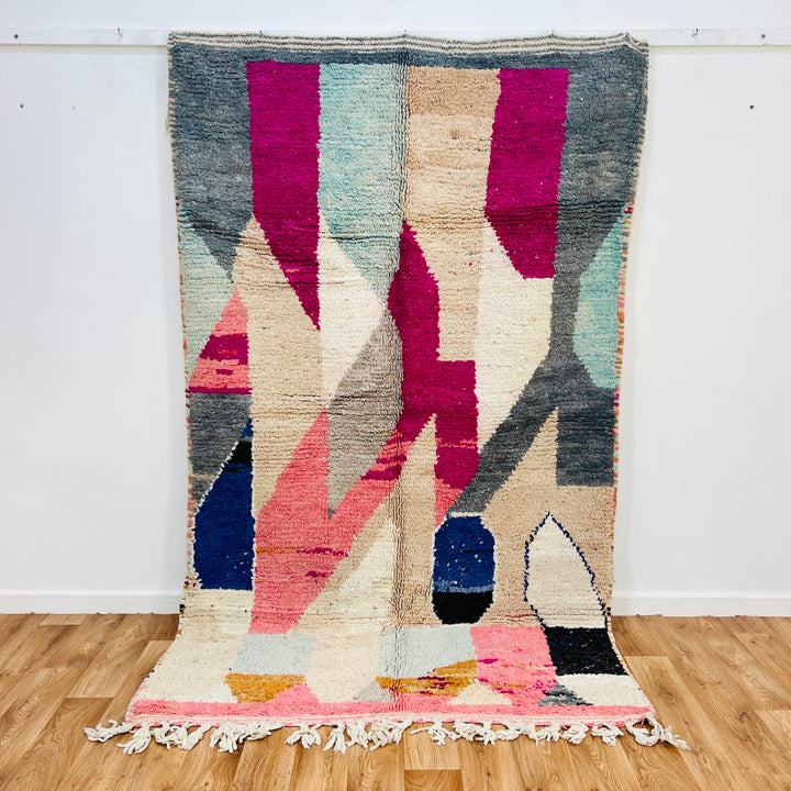 Vintage Abstract Moroccan Rug in pink, beige, navy, grey, mustard. Handwoven wool rug, 254x150 cm, showcases Moroccan Berber art.
