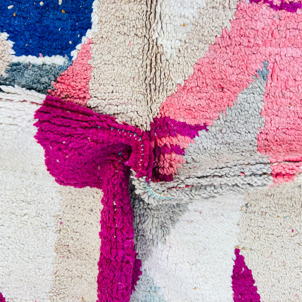 Vintage Moroccan rug with pink, beige, navy, and mustard abstract design, handwoven wool, rich texture, 254 x 150 cm.