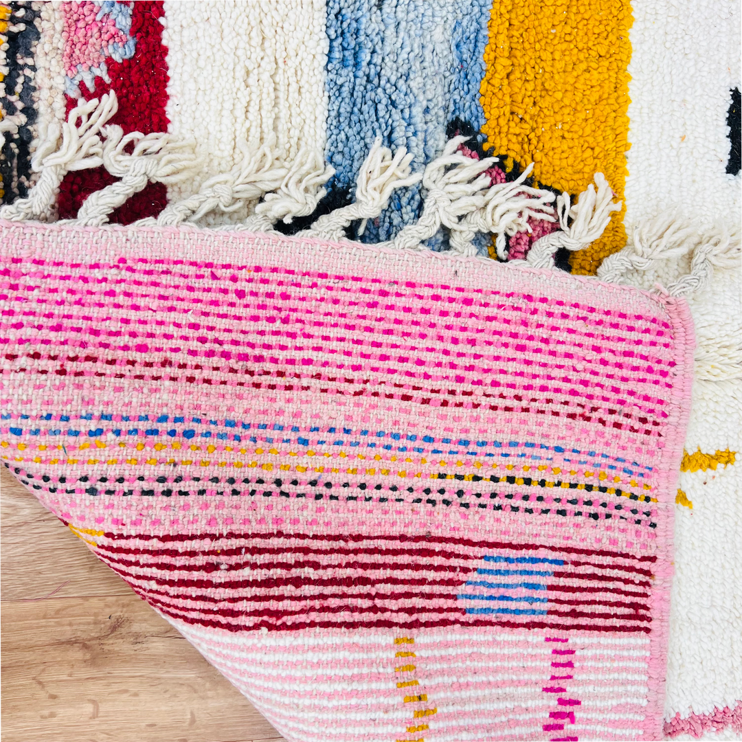Vintage Moroccan Berber rug with colorful abstract patterns, featuring red, pink, orange, and blue on handwoven wool. Size: 8.1 x 5 ft.