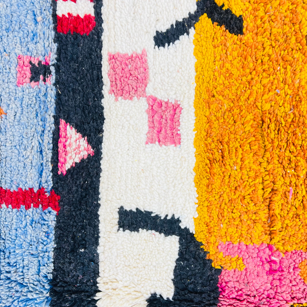 Abstract vintage Moroccan rug with red, orange, pink, blue color bands and Berber symbols. Handwoven wool Moroccan shag rug.