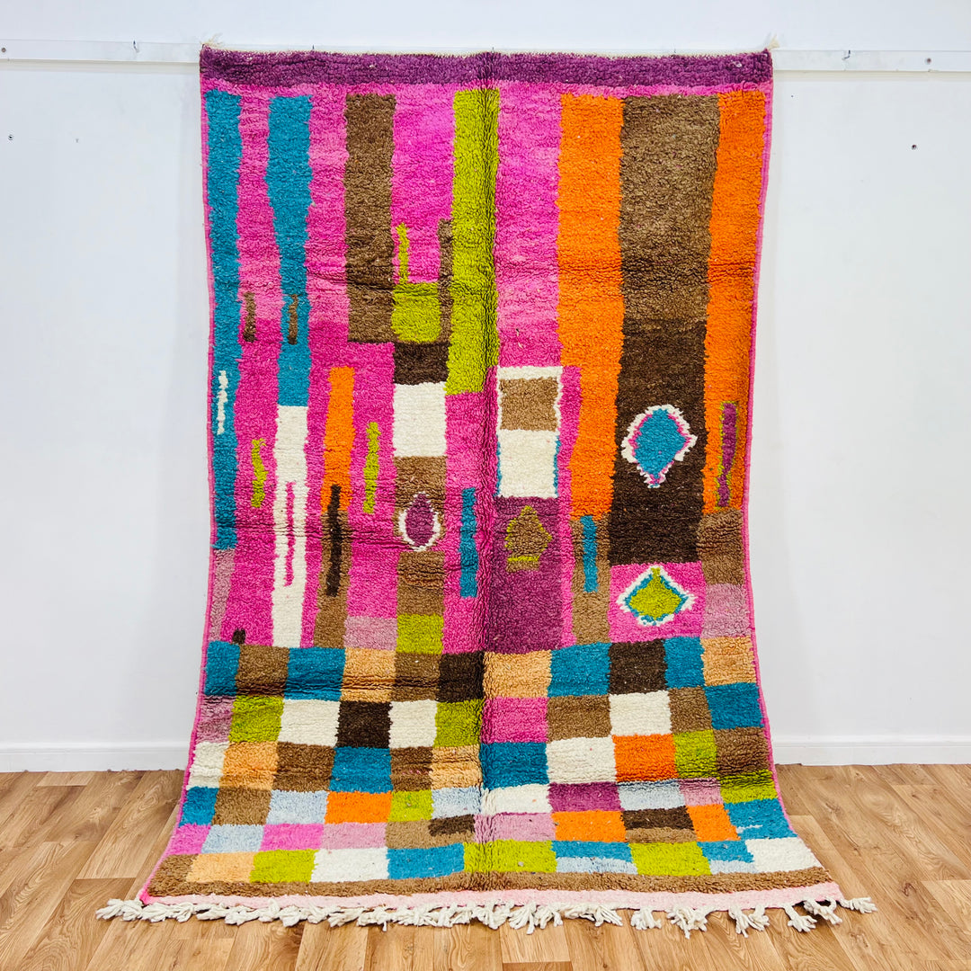 Vintage Moroccan rug with vibrant pink, orange, teal, and lime colors featuring Berber symbols. Size: 247x157 cm (8.1x5.2 ft).