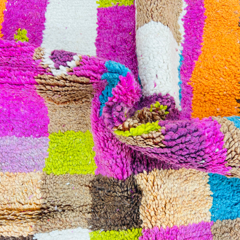 Vintage Moroccan rug with vibrant pink, orange, teal colors and Berber symbols, 100% wool, 247 x 157 cm.