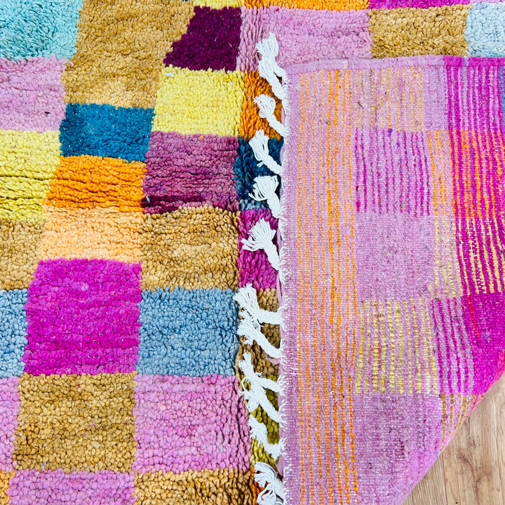 Vintage multicolor Moroccan rug with vibrant checkered pattern in yellow, magenta, blue; handwoven wool, 251x170 cm.