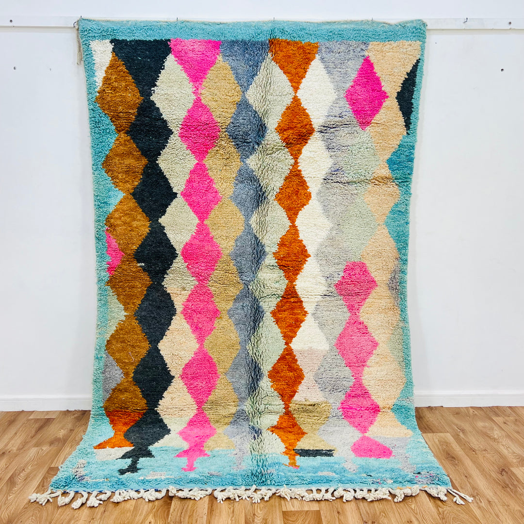 Vintage Moroccan wool rug with bold diamond pattern in pink, terracotta, charcoal, beige, turquoise; hand-knotted, 254x164 cm.
