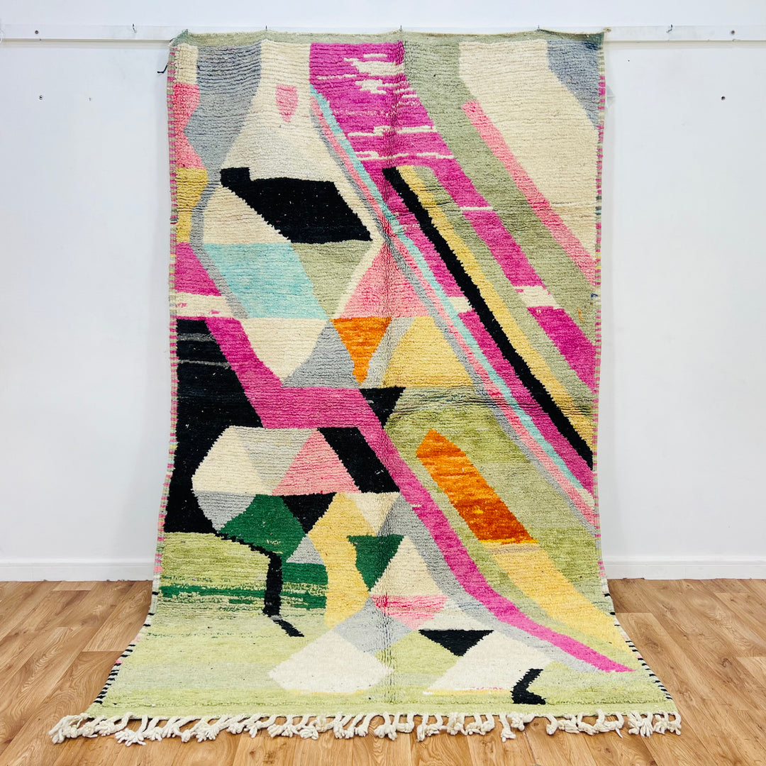 Vintage Moroccan rug with geometric patterns in pink, green, orange, cream, black. Handwoven wool Berber area rug.