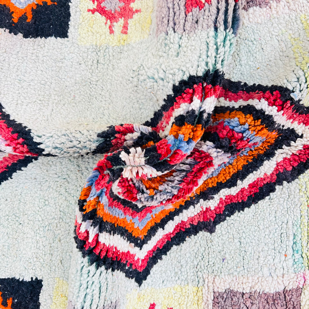 Handmade vintage Moroccan Berber rug with colorful geometric diamond and star patterns. Perfect traditional wool carpet, size 260×155 cm.