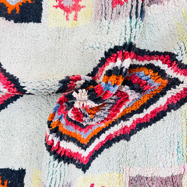 Handmade vintage Moroccan Berber rug with colorful geometric diamond and star patterns. Perfect traditional wool carpet, size 260×155 cm.