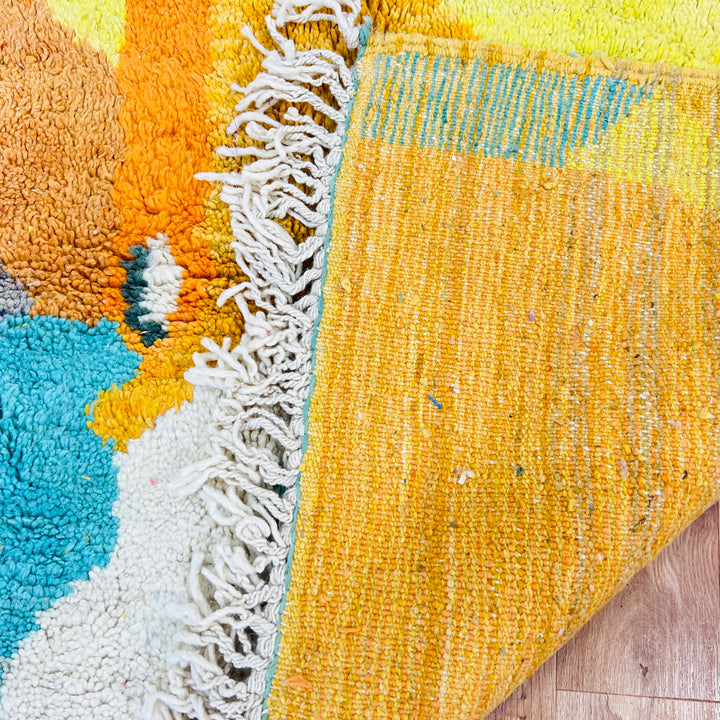 Vintage Moroccan rug with turquoise, mustard, and orange abstract art. Handmade traditional Berber weaving. 260 x 160 cm.