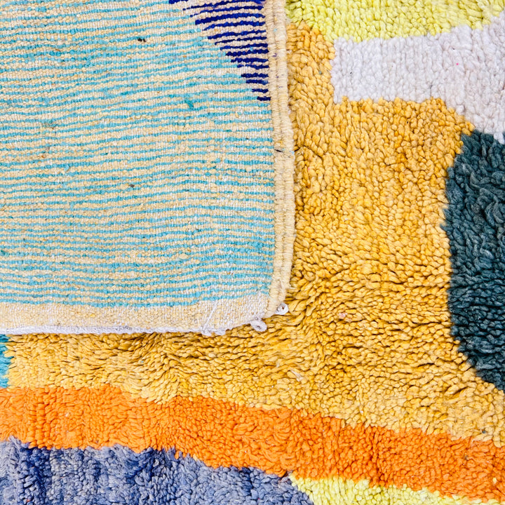 Vintage Moroccan rug with abstract design in turquoise, mustard yellow, green, and orange. Handmade Berber wool area carpet.