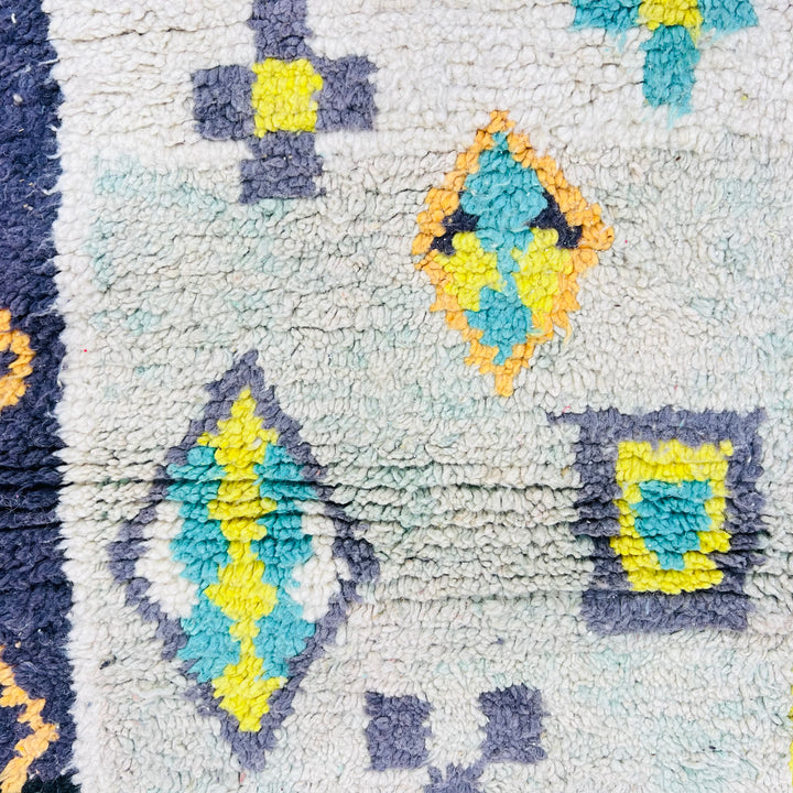 Chevron Vintage Moroccan Berber Rug with colorful geometric patterns and motifs, handmade wool design, traditional Moroccan carpet style.