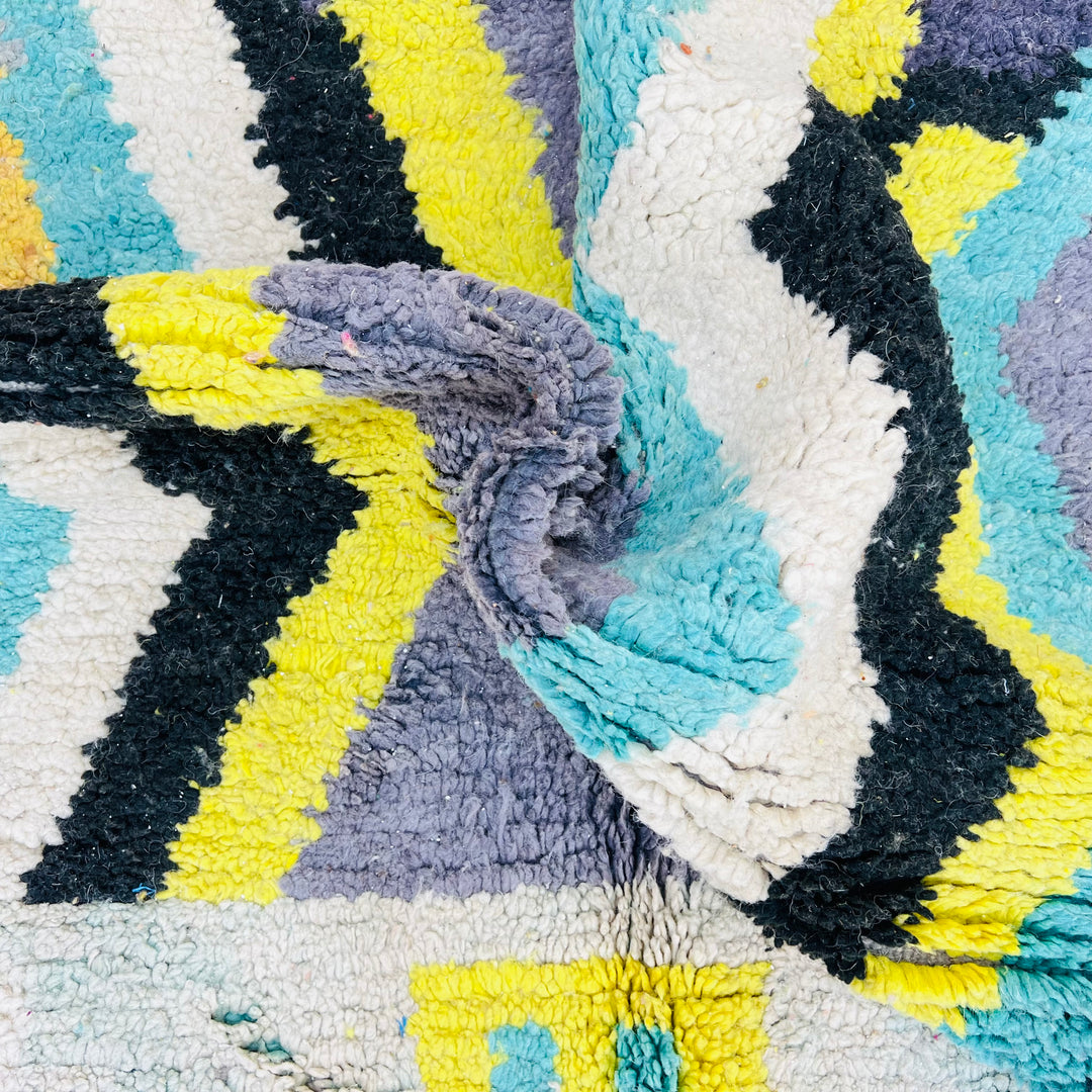Chevron vintage Moroccan rug with vibrant yellow, turquoise, grey, and black zigzag patterns, handmade wool Berber artistry.
