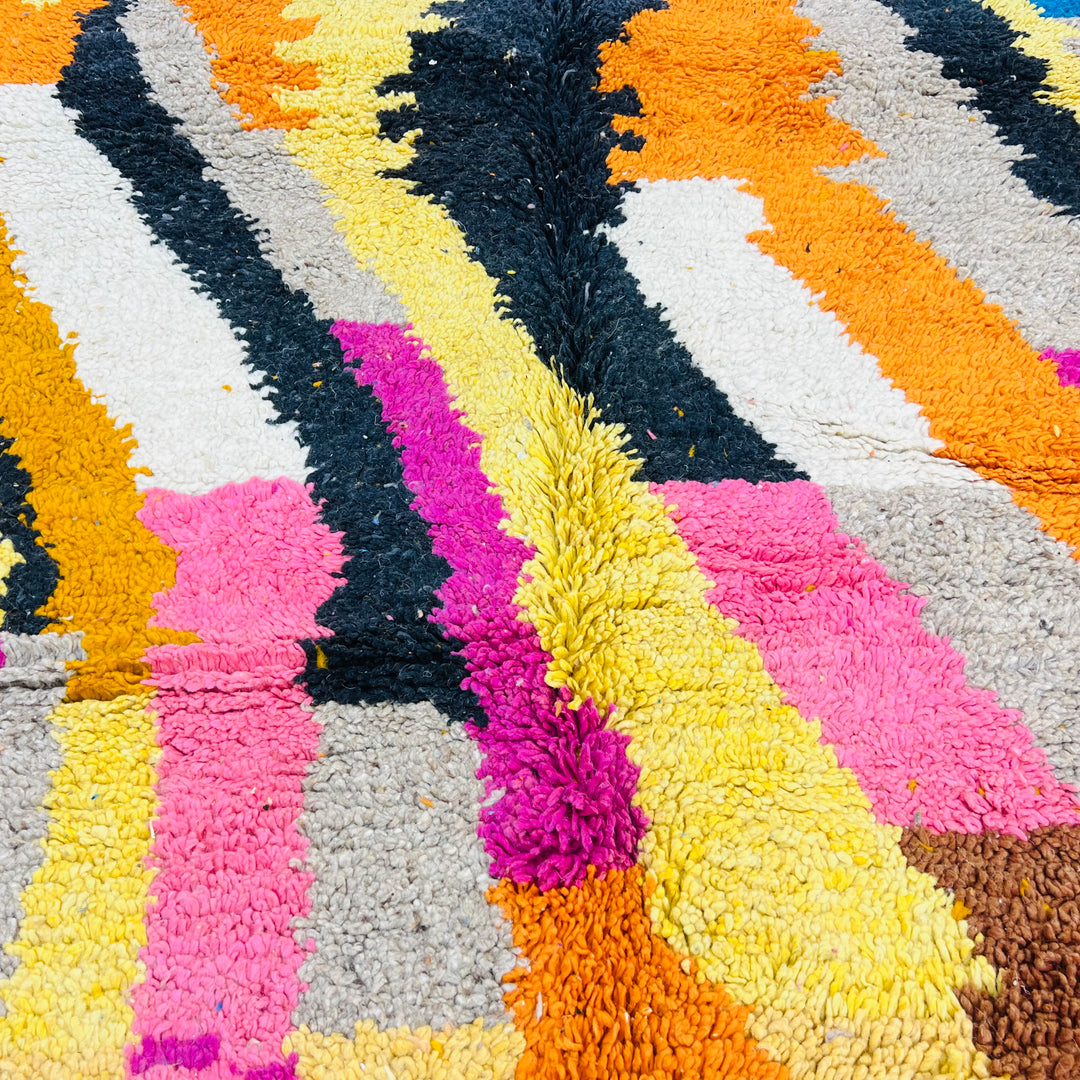 Colorful vintage Moroccan rug with abstract lines in pink, orange, yellow, and black. Handcrafted wool, 8.36 ft x 5.18 ft.